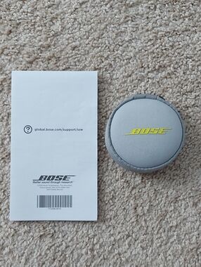 Bose Light Gray Round Earbud Case with Yellow Logo